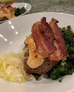 grass-fed hand-made hamburger bbq'd with bacon on top and served with a side of saurkraut and lettuce