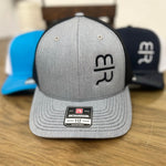 Light gray trucker hat with the black MR brand on the crown.  